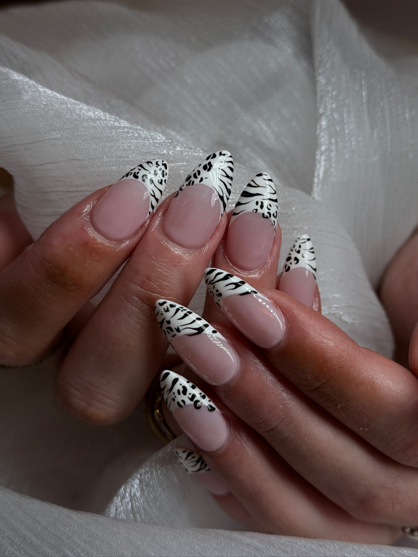 Blume Nail Bar - Luxury Nail Salon — blush almond nails with black leopard and zebra print French tips