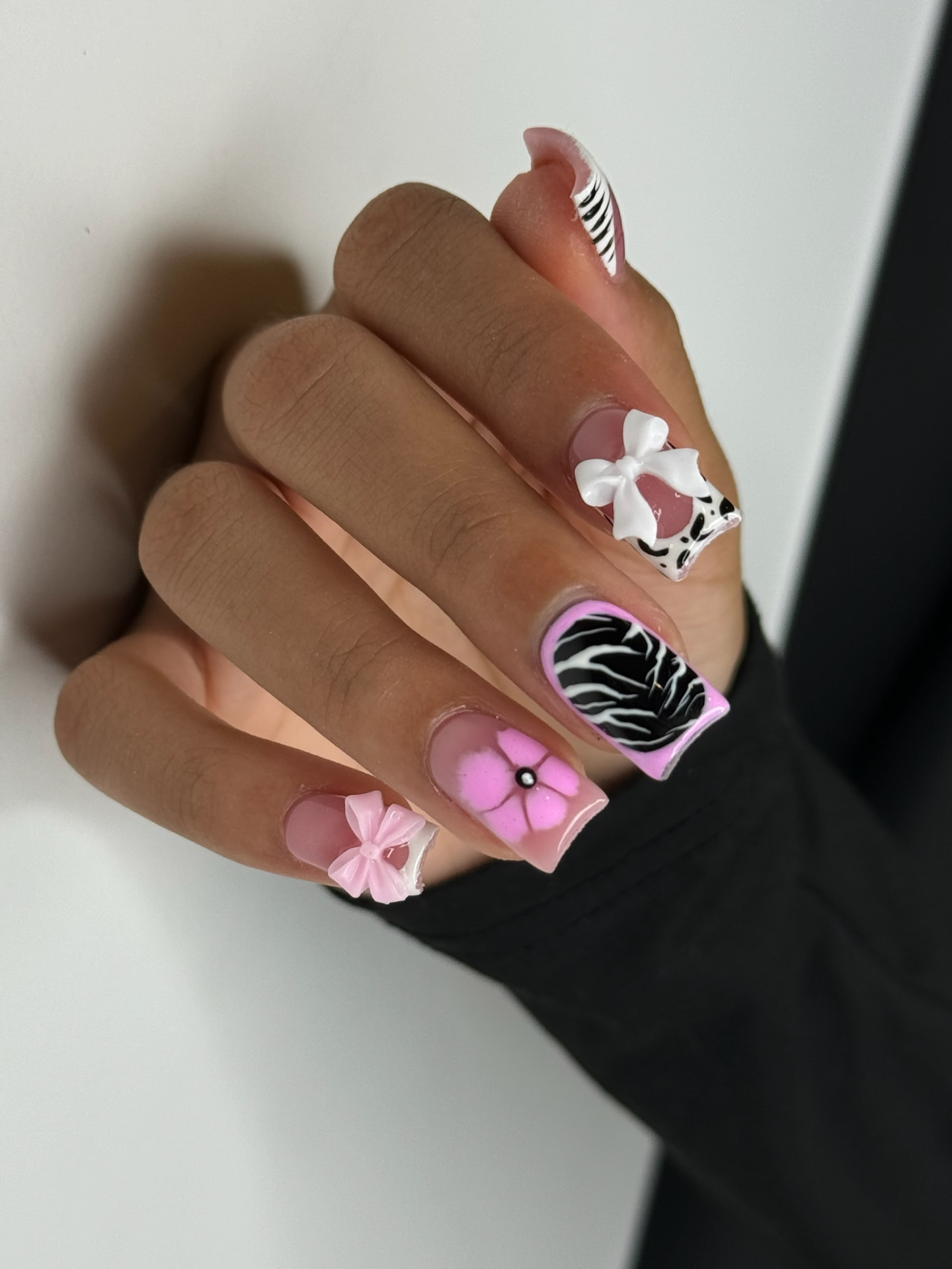 Blume Nail Bar - Luxury Nail Salon — pink chrome nails with bows, zebra print and floral accents