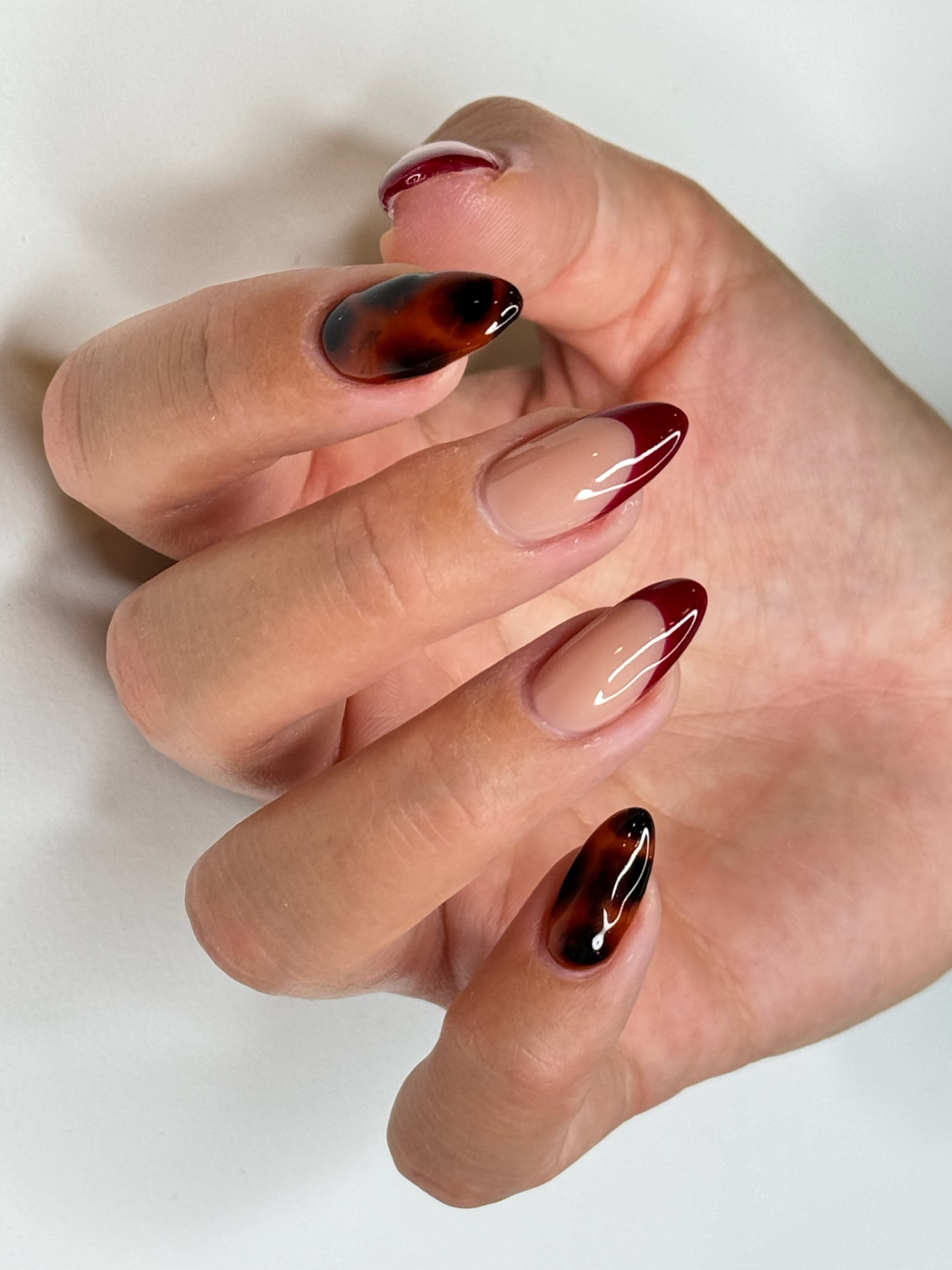Blume Nail Bar - Luxury Nail Salon — tortoiseshell and burgundy French almond nails in Westlake, OH 44145