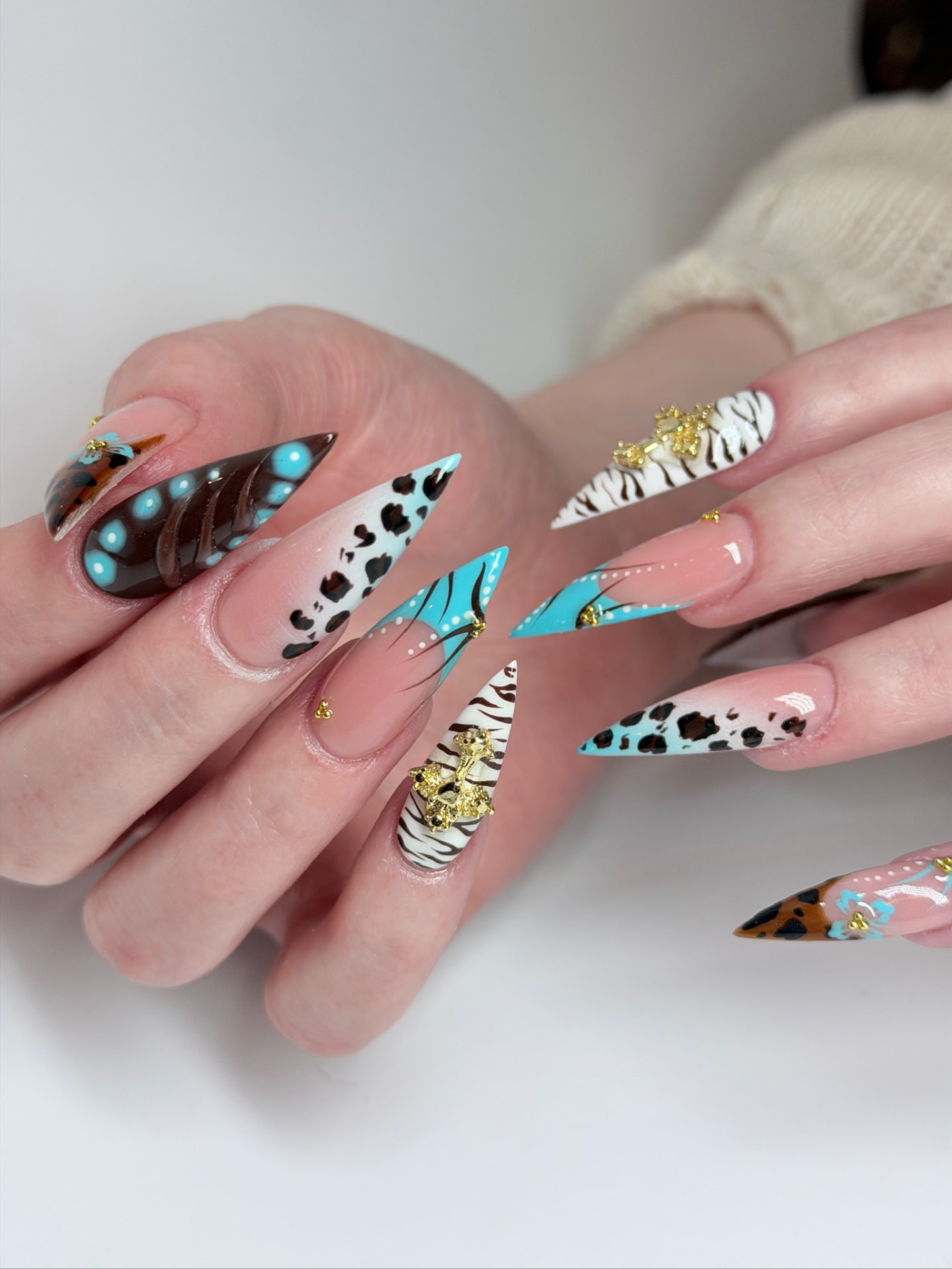 Blume Nail Bar - Luxury Nail Salon — stiletto nails blending leopard, zebra and chocolate marble with 3D florals