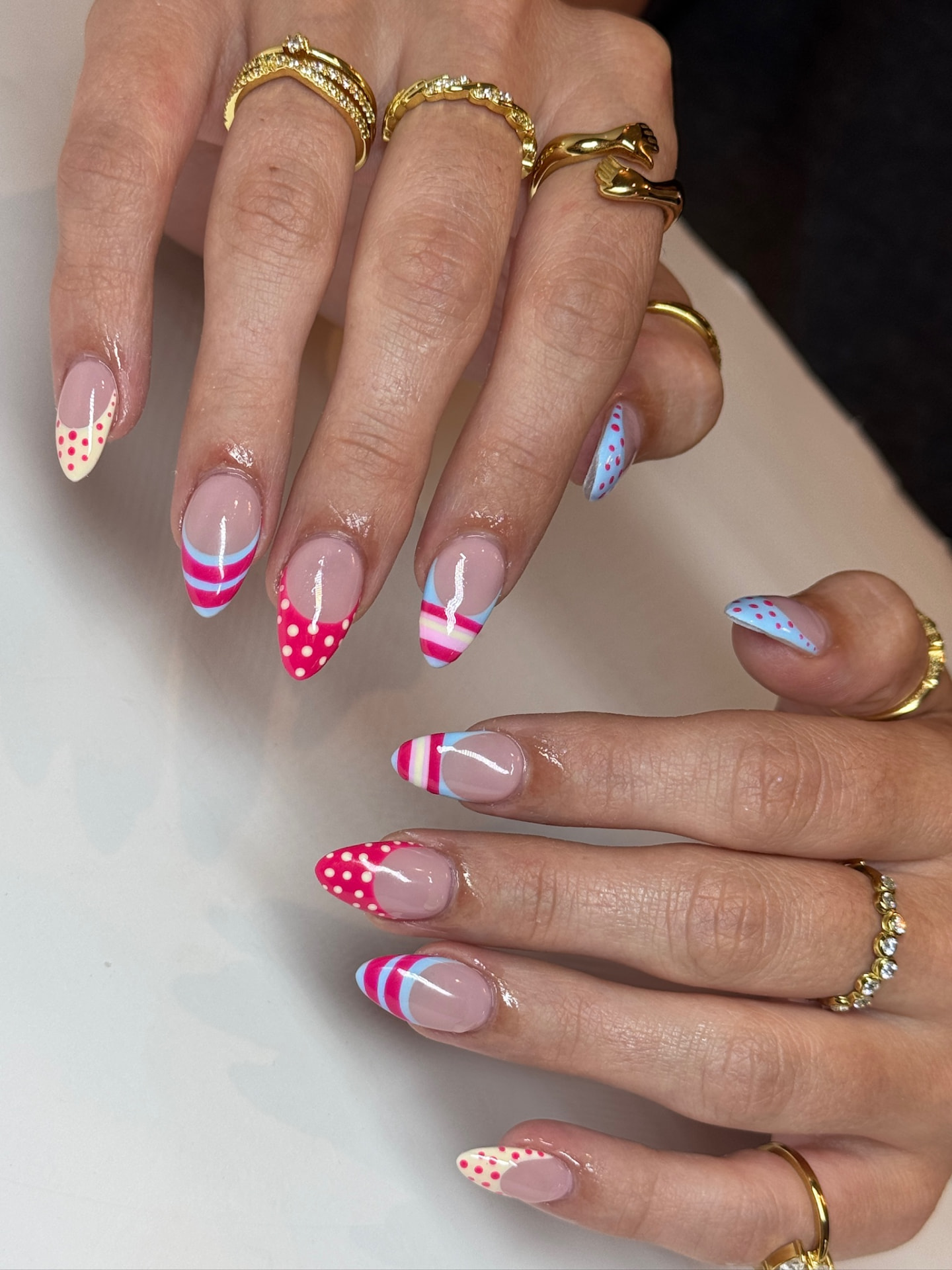 Blume Nail Bar - Luxury Nail Salon — stiletto nails in cherry red and blue with polka dots and stripes